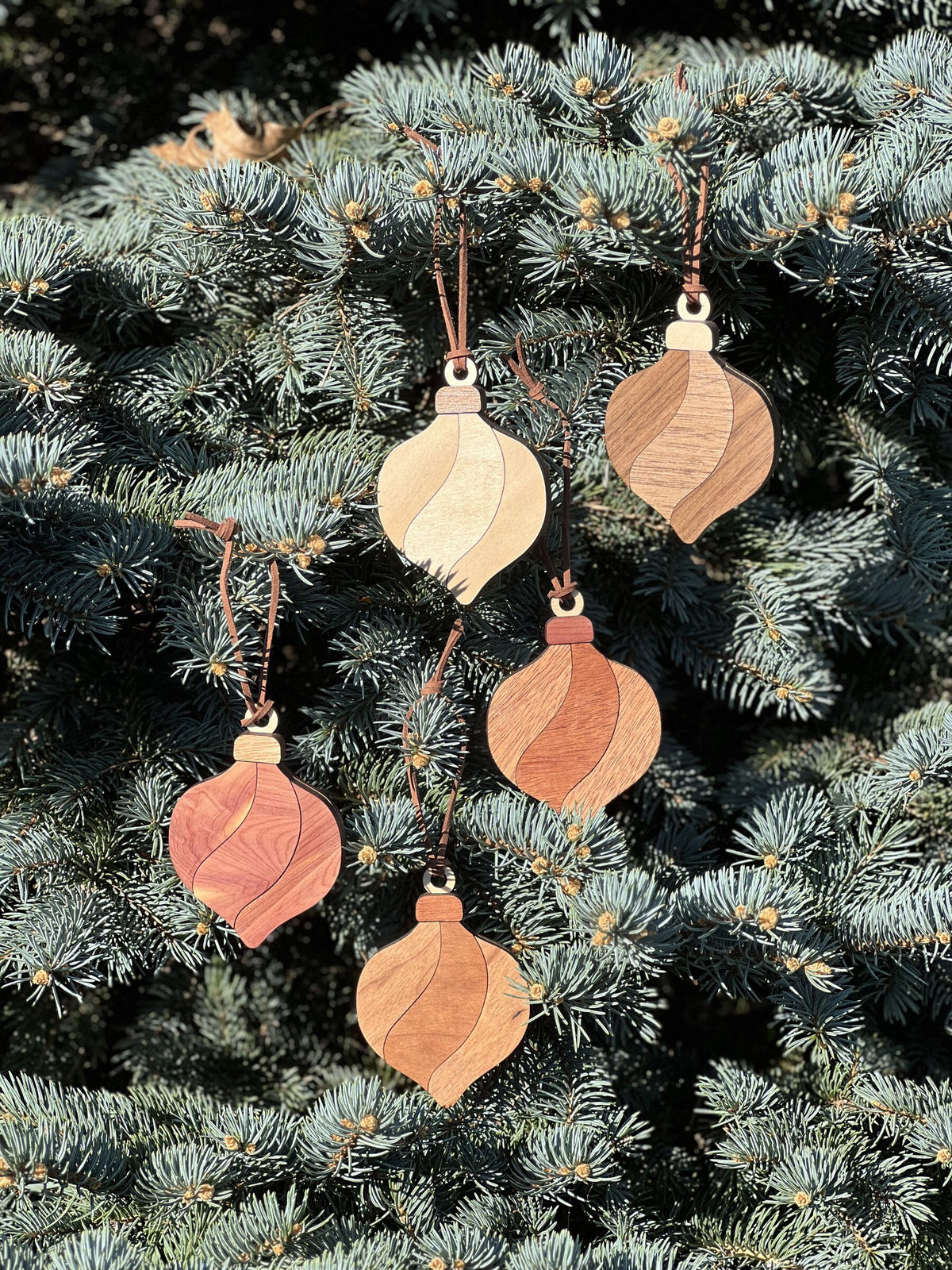 Classic wood ornaments in five woods